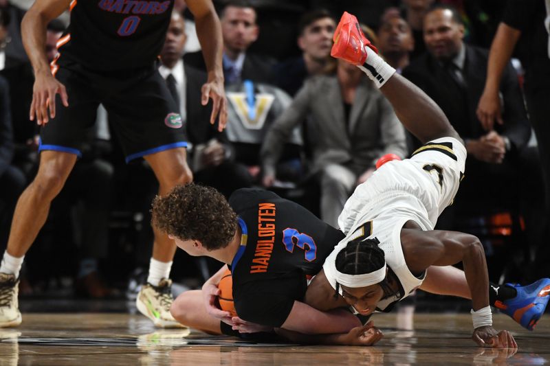 Mar 9, 2024; Nashville, Tennessee, USA; Florida Gators center Micah Handlogten (3) and Vanderbilt Commodores guard Ezra Manjon (5) dive for a loose ball during the second half at Memorial Gymnasium. Mandatory Credit: Christopher Hanewinckel-USA TODAY Sports