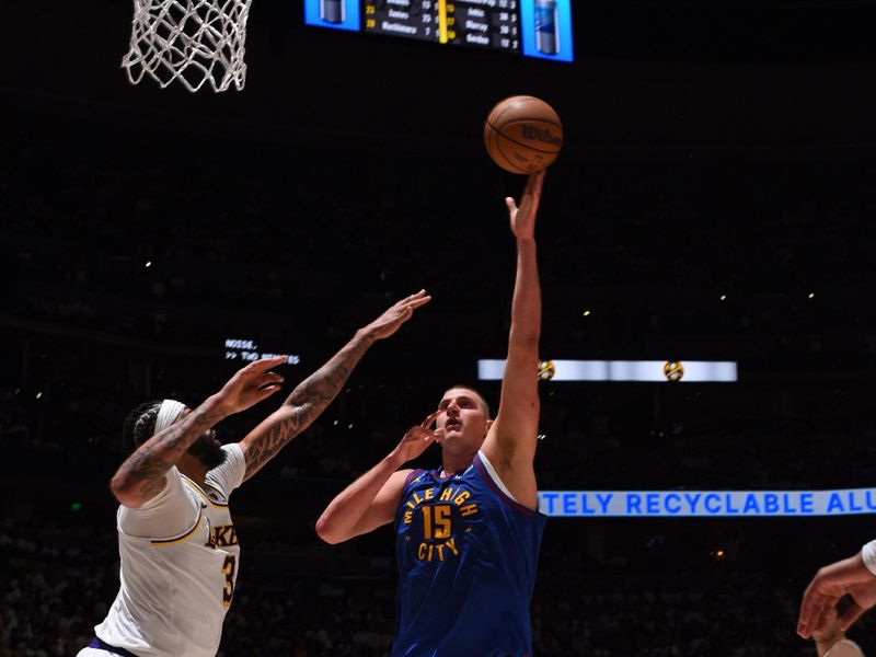 DENVER, CO - APRIL 20: Nikola Jokic #15 of the Denver Nuggets drives to the basket during the game against the Los Angeles Lakers during Round 1 Game 1 of the 2024 NBA Playoffs on April 20, 2024 at the Ball Arena in Denver, Colorado. NOTE TO USER: User expressly acknowledges and agrees that, by downloading and/or using this Photograph, user is consenting to the terms and conditions of the Getty Images License Agreement. Mandatory Copyright Notice: Copyright 2024 NBAE (Photo by Garrett Ellwood/NBAE via Getty Images)