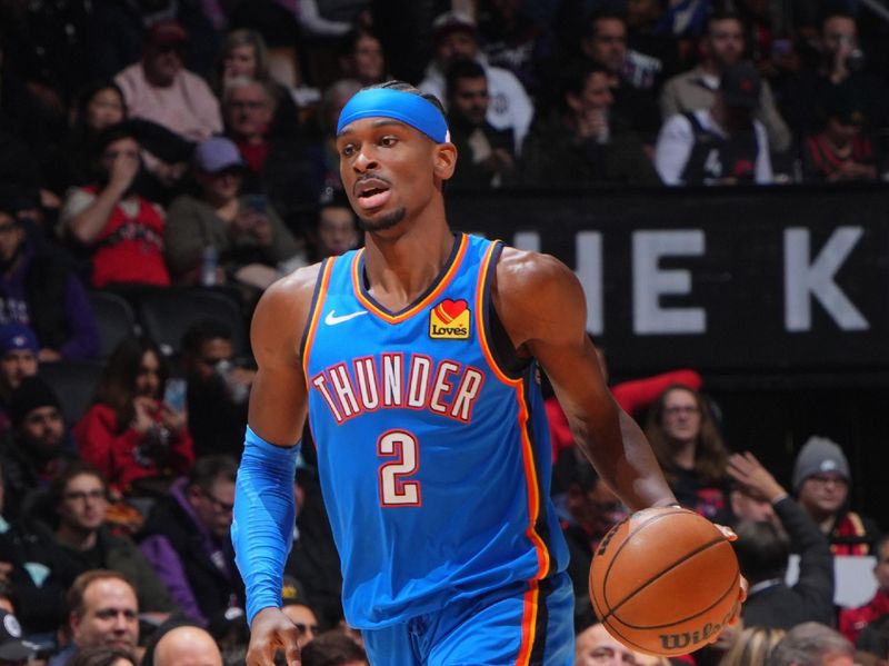 TORONTO, CANADA - DECEMBER 05: Shai Gilgeous-Alexander #2 of the Oklahoma City Thunder dribbles the ball during the game against the Toronto Raptors on December 05, 2024 at the Scotiabank Arena in Toronto, Ontario, Canada.  NOTE TO USER: User expressly acknowledges and agrees that, by downloading and or using this Photograph, user is consenting to the terms and conditions of the Getty Images License Agreement.  Mandatory Copyright Notice: Copyright 2024 NBAE (Photo by Mark Blinch/NBAE via Getty Images)