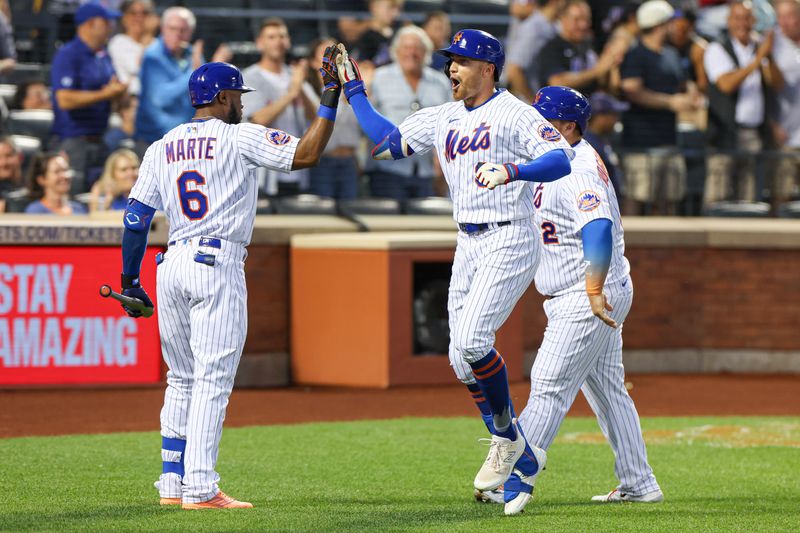 Jun 27, 2023; New York City, New York, USA; New York Mets center fielder Brandon Nimmo (9) celebrates with right fielder Starling Marte (6) after his two run home run during the fifth inning against the Milwaukee Brewers  at Citi Field. Mandatory Credit: Vincent Carchietta-USA TODAY Sports