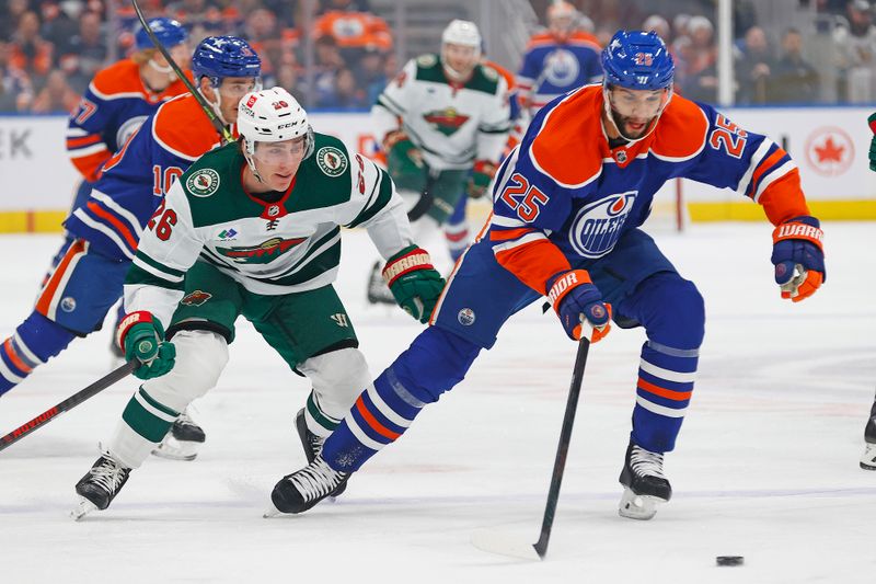 Dec 8, 2023; Edmonton, Alberta, CAN; Edmonton Oilers defensemen Darnell Nurse (25) and Minnesota Wild forward Connor Dewar (26) chase after a loose puck during the first period at Rogers Place. Mandatory Credit: Perry Nelson-USA TODAY Sports