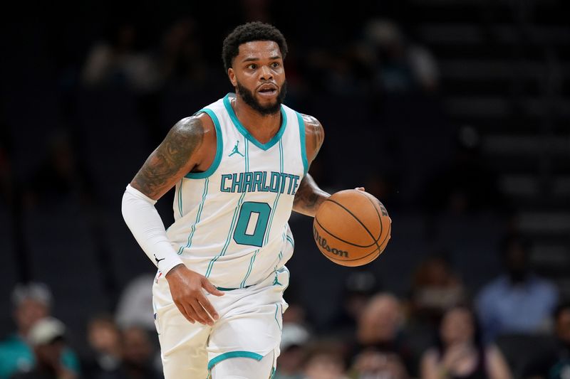 CHARLOTTE, NORTH CAROLINA - OCTOBER 08: Miles Bridges #0 of the Charlotte Hornets moves the ball against the Miami Heat during the first half of the preseason game at Spectrum Center on October 08, 2024 in Charlotte, North Carolina. NOTE TO USER: User expressly acknowledges and agrees that, by downloading and or using this photograph, User is consenting to the terms and conditions of the Getty Images License Agreement. (Photo by Grant Halverson/Getty Images)