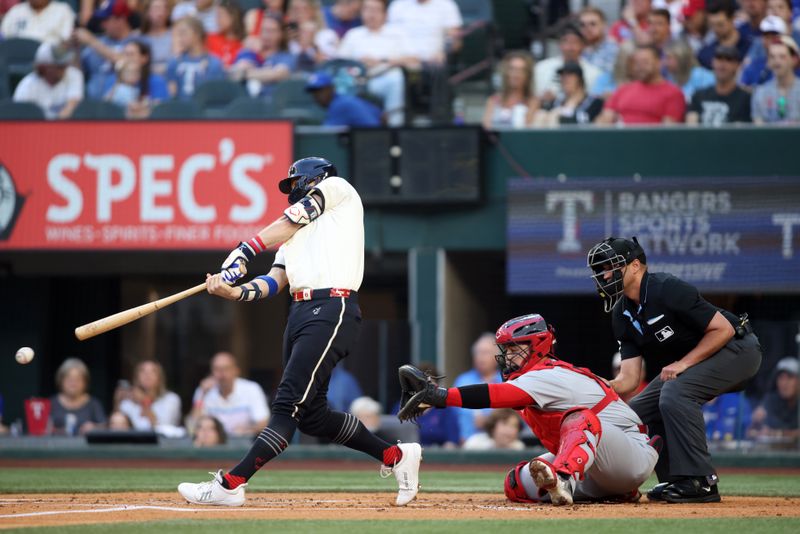 May 30, 2025; Arlington, Texas, USA; Texas Rangers third base Josh Jung (6) singles in a run during the first inning against the St. Louis Cardinals at Globe Life Field. Mandatory Credit: Tim Heitman-Imagn Images