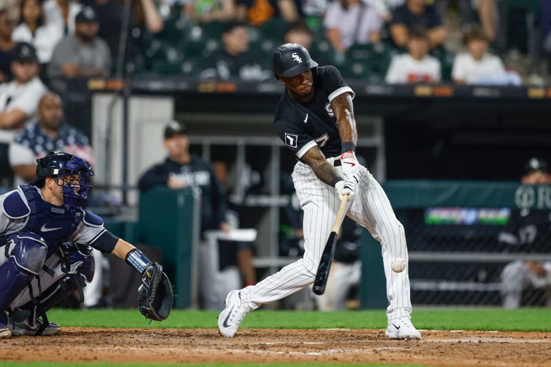 Aug 9, 2023; Chicago, Illinois, USA; Chicago White Sox shortstop Tim Anderson (7) hits an RBI single against the New York Yankees during the eight inning at Guaranteed Rate Field. Mandatory Credit: Kamil Krzaczynski-USA TODAY Sports