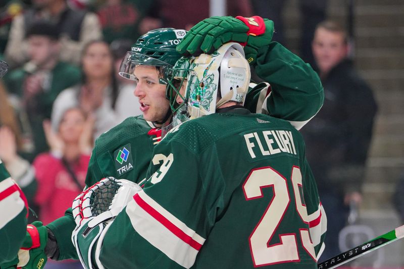 Apr 2, 2024; Saint Paul, Minnesota, USA; Minnesota Wild defenseman Brock Faber (7) congratulates goaltender Marc-Andre Fleury (29) after the game against the Ottawa Senators at Xcel Energy Center. Mandatory Credit: Brad Rempel-USA TODAY Sports