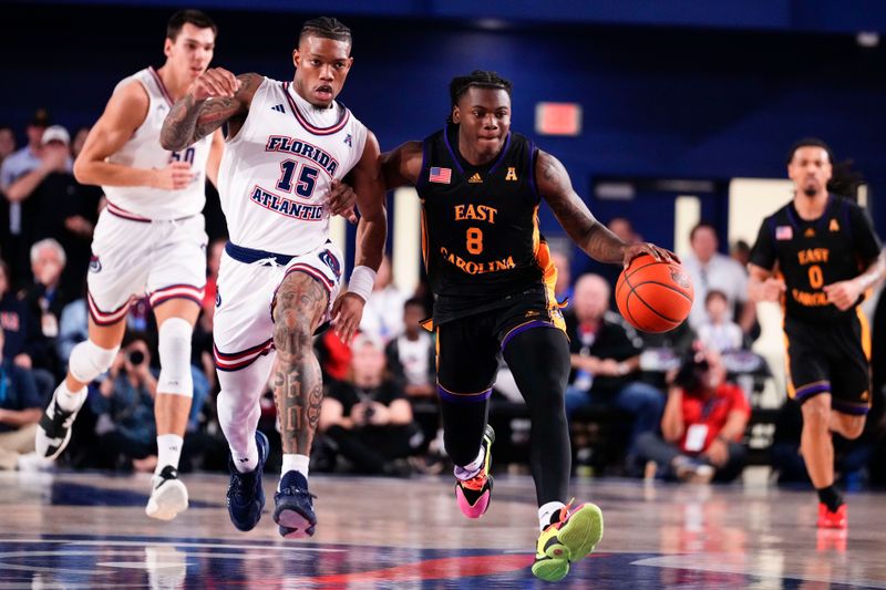 Jan 2, 2024; Boca Raton, Florida, USA; East Carolina Pirates guard Cam Hayes (8) dribbles the ball against Florida Atlantic Owls guard Alijah Martin (15) during the first half at Eleanor R. Baldwin Arena. Mandatory Credit: Rich Storry-USA TODAY Sports