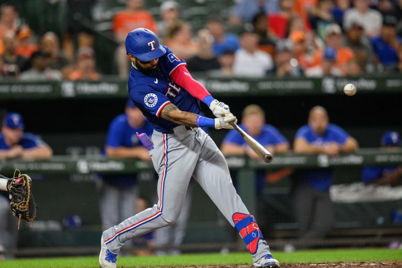 Jun 30, 2024; Baltimore, Maryland, USA; Texas Rangers outfielder Derek Hill (40) hits a home run during the fifth inning against the Baltimore Orioles at Oriole Park at Camden Yards. Mandatory Credit: Reggie Hildred-USA TODAY Sports