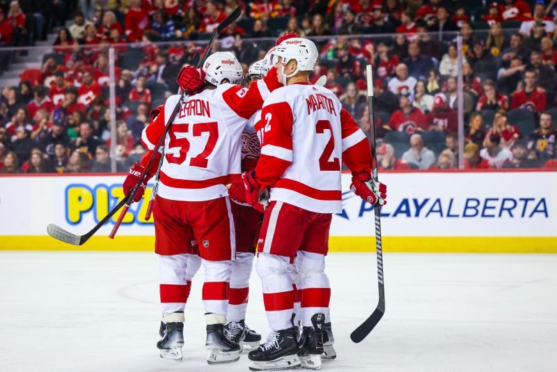 Feb 17, 2024; Calgary, Alberta, CAN; Detroit Red Wings left wing David Perron (57) celebrates his goal with teammates against the Calgary Flames during the second period at Scotiabank Saddledome. Mandatory Credit: Sergei Belski-USA TODAY Sports