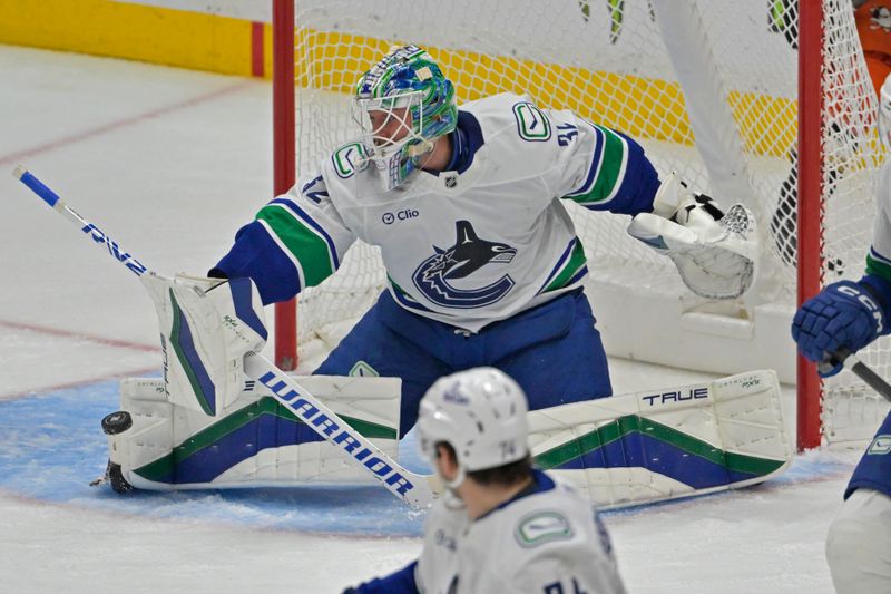 Nov 5, 2024; Anaheim, California, USA; Vancouver Canucks goaltender Kevin Lankinen (32) makes a save in the third period against the Anaheim Ducks at Honda Center. Mandatory Credit: Jayne Kamin-Oncea-Imagn Images