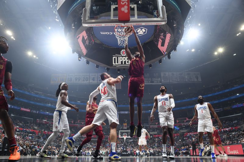 LOS ANGELES, CA - APRIL 7: Evan Mobley #4 of the Cleveland Cavaliers dunks the ball during the game against the LA Clippers on April 7, 2024 at Crypto.Com Arena in Los Angeles, California. NOTE TO USER: User expressly acknowledges and agrees that, by downloading and/or using this Photograph, user is consenting to the terms and conditions of the Getty Images License Agreement. Mandatory Copyright Notice: Copyright 2024 NBAE (Photo by Adam Pantozzi/NBAE via Getty Images)