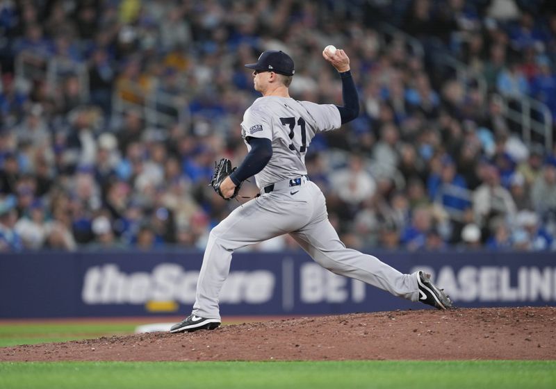 Apr 17, 2024; Toronto, Ontario, CAN; New York Yankees relief pitcher Ian Hamilton (71) throws a pitch against the Toronto Blue Jays during the seventh inning at Rogers Centre. Mandatory Credit: Nick Turchiaro-USA TODAY Sports