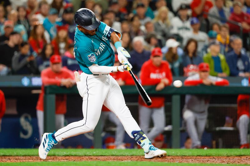 Sep 12, 2023; Seattle, Washington, USA; Seattle Mariners center fielder Julio Rodriguez (44) hits an RBI-single against the Los Angeles Angels during the fourth inning at T-Mobile Park. Mandatory Credit: Joe Nicholson-USA TODAY Sports