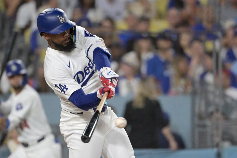 Jul 22, 2024; Los Angeles, California, USA;  Los Angeles Dodgers left fielder Teoscar Hernandez (37) hits a RBI single in the sixth inning against the Los Angeles Dodgers at Dodger Stadium. Mandatory Credit: Jayne Kamin-Oncea-USA TODAY Sports