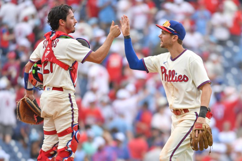 Jun 11, 2023; Philadelphia, Pennsylvania, USA; Philadelphia Phillies catcher Garrett Stubbs (21) and shortstop Trea Turner (7) celebrates win against the Los Angeles Dodgers at Citizens Bank Park. Mandatory Credit: Eric Hartline-USA TODAY Sports