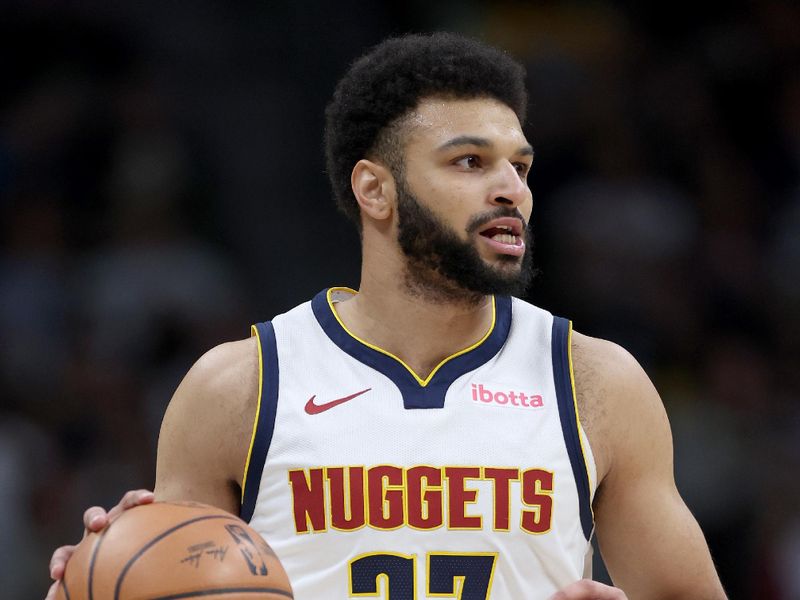 DENVER, COLORADO - DECEMBER 29: Jamal Murray #27 of the Denver Nuggets brings the ball down the court against the Oklahoma City Thunder in the first quarter at Ball Arena on December 29, 2023 in Denver, Colorado. NOTE TO USER: User expressly acknowledges and agrees that, by downloading and or using this photograph, User is consenting to the terms and conditions of the Getty Images License Agreement.  (Photo by Matthew Stockman/Getty Images)