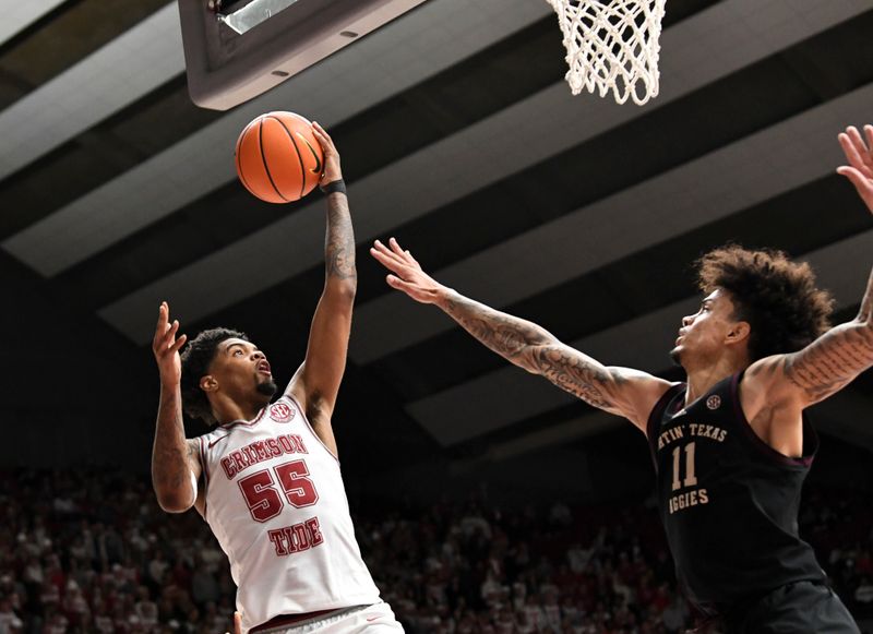 Feb 17, 2024; Tuscaloosa, Alabama, USA; Alabama Crimson Tide guard Aaron Estrada drives the basket against Texas A&M Aggies forward Andersson Garcia (11) during the second half at Coleman Coliseum. Alabama won 100-75. Mandatory Credit: Gary Cosby Jr.-USA TODAY Sports