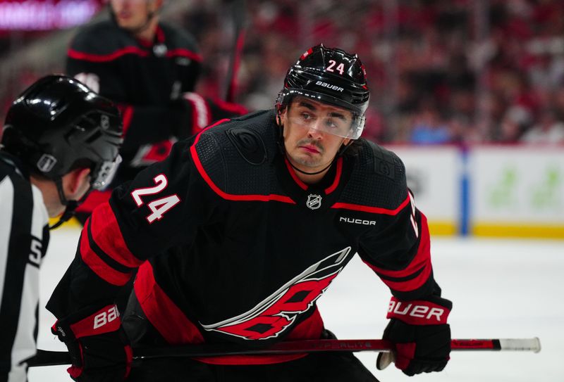 Apr 20, 2024; Raleigh, North Carolina, USA; Carolina Hurricanes center Seth Jarvis (24) looks on against the New York Islanders during the first period in game one of the first round of the 2024 Stanley Cup Playoffs at PNC Arena. Mandatory Credit: James Guillory-USA TODAY Sports