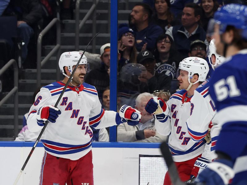 Nov 12, 2025; Tampa, Florida, USA; New York Rangers center Vincent Trocheck (16) is congratulated after he scored a goal against the Tampa Bay Lightning during the second period at Benchmark International Arena. Mandatory Credit: Kim Klement Neitzel-Imagn Images