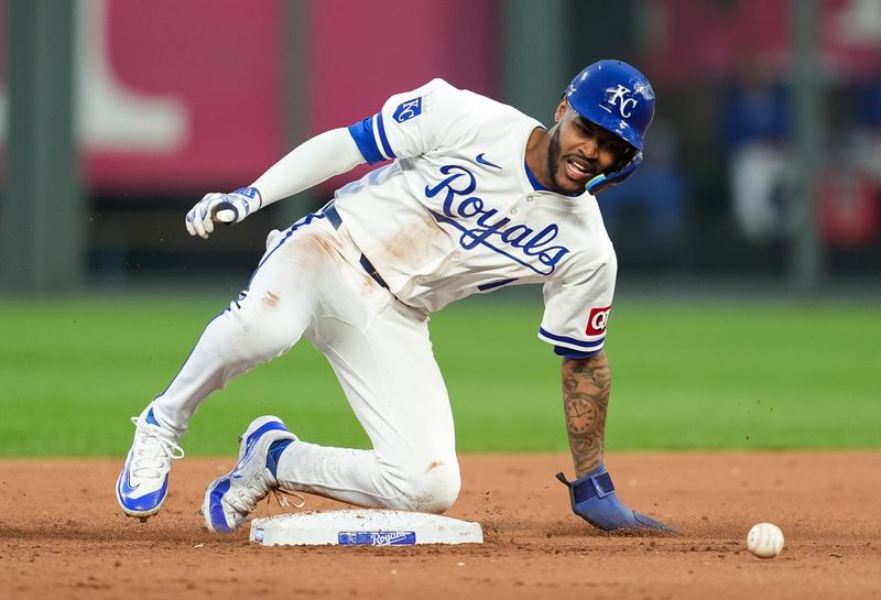 Aug 10, 2024; Kansas City, Missouri, USA; Kansas City Royals second baseman Maikel Garcia (11) steals second base during the seventh inning against the St. Louis Cardinals at Kauffman Stadium. Mandatory Credit: Jay Biggerstaff-USA TODAY Sports
