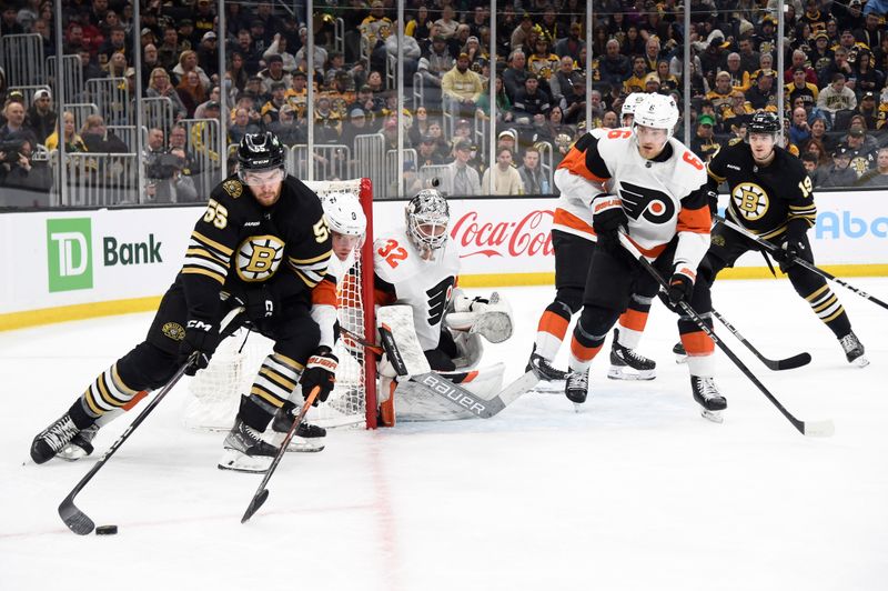 Mar 16, 2024; Boston, Massachusetts, USA; Boston Bruins right wing Justin Brazeau (55) handles the puck while Philadelphia Flyers defenseman Jamie Drysdale (9) defends during the third period at TD Garden. Mandatory Credit: Bob DeChiara-USA TODAY Sports