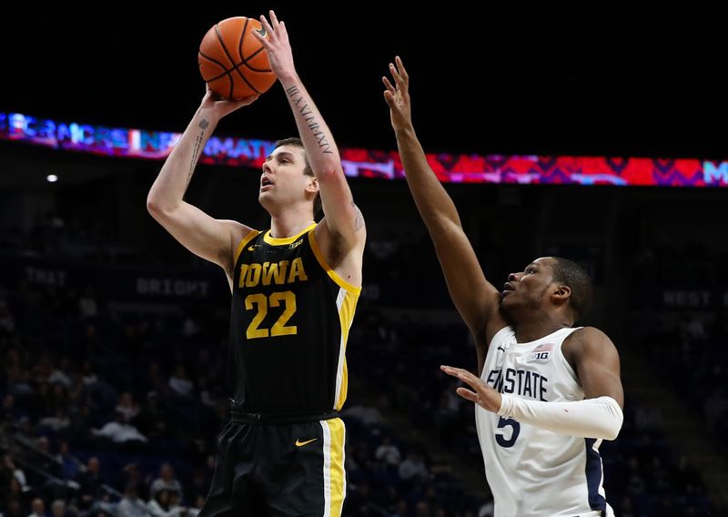 Feb 8, 2024; University Park, Pennsylvania, USA; Iowa Hawkeyes forward Patrick McCaffery (22) shoots the ball as Penn State Nittany Lions guard Jameel Brown (5) defends during the second half at Bryce Jordan Center. Penn State defeated Iowa 89-79. Mandatory Credit: Matthew O'Haren-USA TODAY Sports