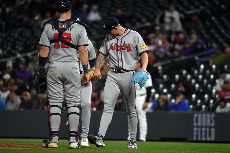 Apr 29, 2025; Denver, Colorado, USA; Atlanta Braves pitcher AJ Smith-Shawver (32) checks his arm after being hit by a line drive during the sixth inning against the Colorado Rockies at Coors Field. Mandatory Credit: Christopher Hanewinckel-Imagn Images