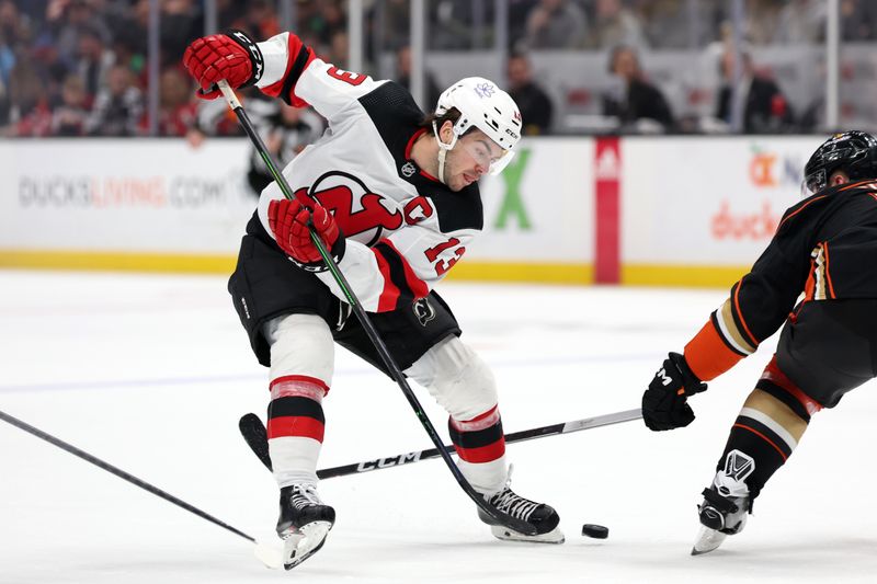 Mar 1, 2024; Anaheim, California, USA; New Jersey Devils center Nico Hischier (13) controls the puck during the third period against the Anaheim Ducks at Honda Center. Mandatory Credit: Kiyoshi Mio-USA TODAY Sports