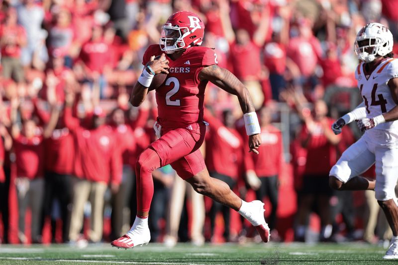 Sep 16, 2023; Piscataway, New Jersey, USA;  Rutgers Scarlet Knights quarterback Gavin Wimsatt (2) scores a rushing touchdown during the first half in front of Virginia Tech Hokies cornerback Dorian Strong (44) at SHI Stadium. Mandatory Credit: Vincent Carchietta-USA TODAY Sports