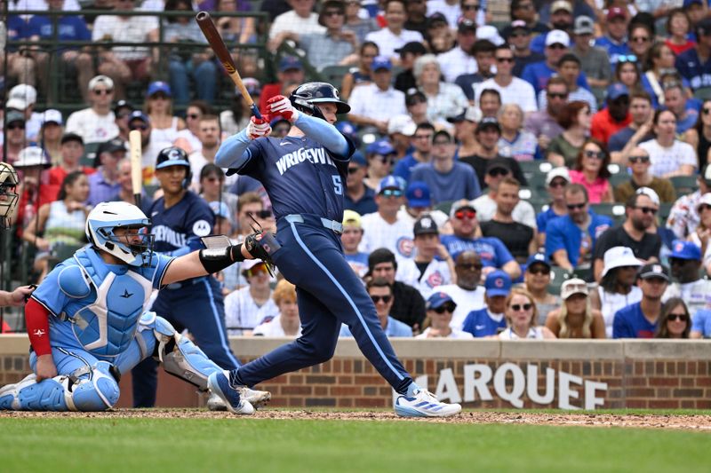 Aug 16, 2024; Chicago, Illinois, USA;  Chicago Cubs outfielder Pete Crow-Armstrong (52) hits a home run against the Toronto Blue Jays during the fifth inning at Wrigley Field. Mandatory Credit: Matt Marton-USA TODAY Sports