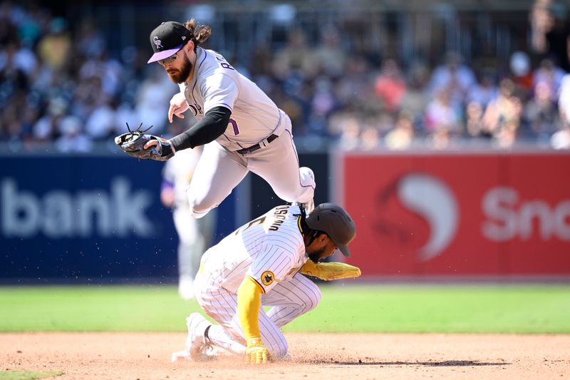 Sep 20, 2023; San Diego, California, USA; Colorado Rockies second baseman Brendan Rodgers (7) forces out San Diego Padres third baseman Eguy Rosario (5) at second base during the sixth inning at Petco Park. Mandatory Credit: Orlando Ramirez-USA TODAY Sports