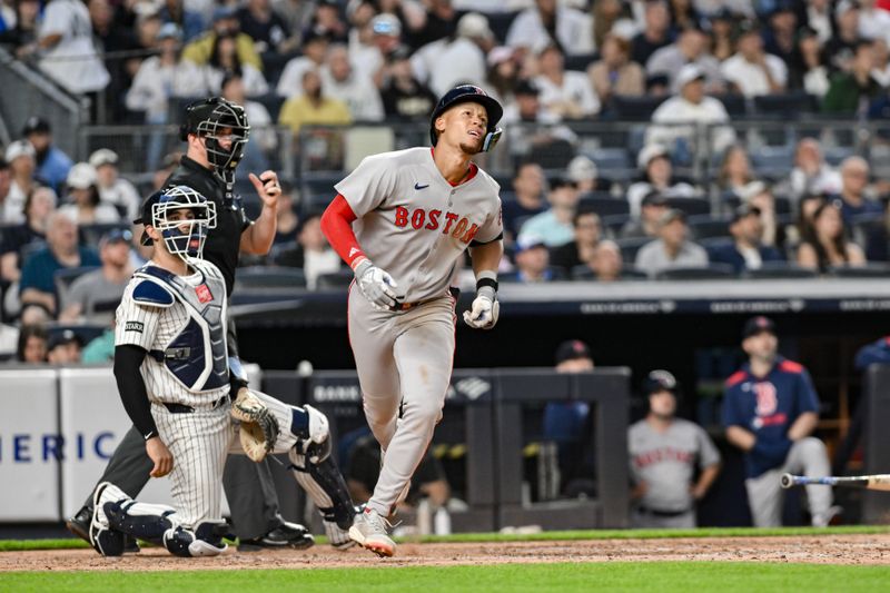 Jun 8, 2025; Bronx, New York, USA; Boston Red Sox second baseman Kristian Campbell (28) hits a two-run home run against the New York Yankees during the fifth inning at Yankee Stadium. Mandatory Credit: John Jones-Imagn Images