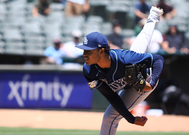 Jun 15, 2023; Oakland, California, USA; Tampa Bay Rays starting pitcher Taj Bradley (45) pitches the ball against the Oakland Athletics during the first inning at Oakland-Alameda County Coliseum. Mandatory Credit: Kelley L Cox-USA TODAY Sports