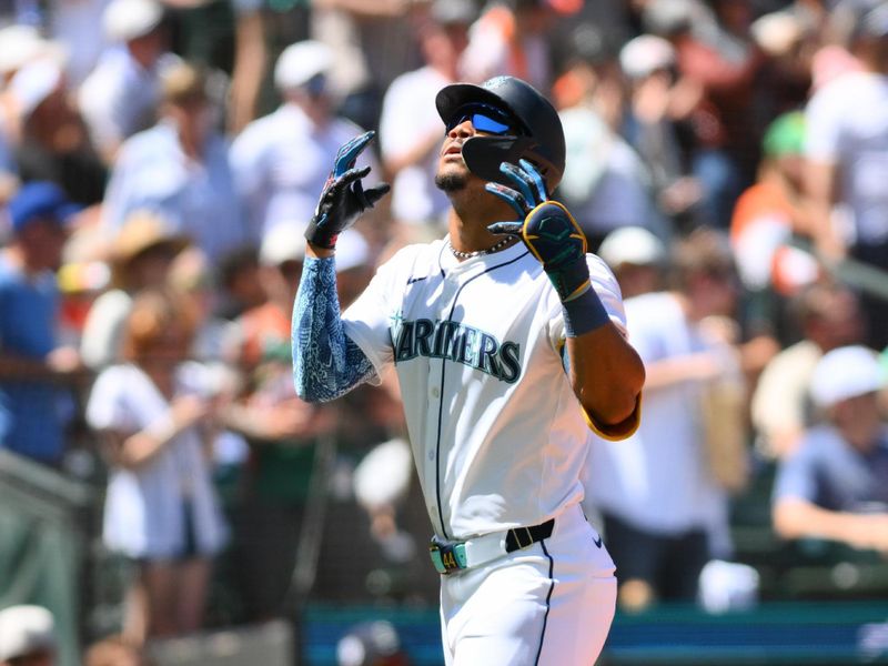 Jul 4, 2024; Seattle, Washington, USA; Seattle Mariners center fielder Julio Rodriguez (44) celebrates hitting a home run against the Baltimore Orioles during the fifth inning at T-Mobile Park. Mandatory Credit: Steven Bisig-USA TODAY Sports