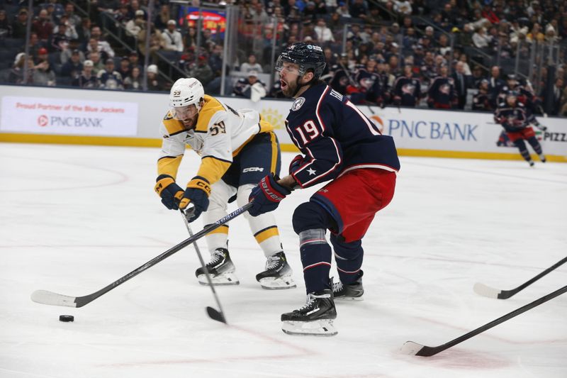 Mar 3, 2026; Columbus, Ohio, USA; Columbus Blue Jackets center Adam Fantilli (19) reacts after taking a high stick from Nashville Predators defenseman Roman Josi (59) during the second period at Nationwide Arena. Mandatory Credit: Russell LaBounty-Imagn Images