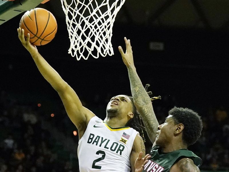 Dec 22, 2023; Waco, Texas, USA; Baylor Bears guard Jayden Nunn (2) shoots the ball past Mississippi Valley State Delta Devils guard Rayquan Brown (0) during the second half at Ferrell Center. Mandatory Credit: Raymond Carlin III-USA TODAY Sports