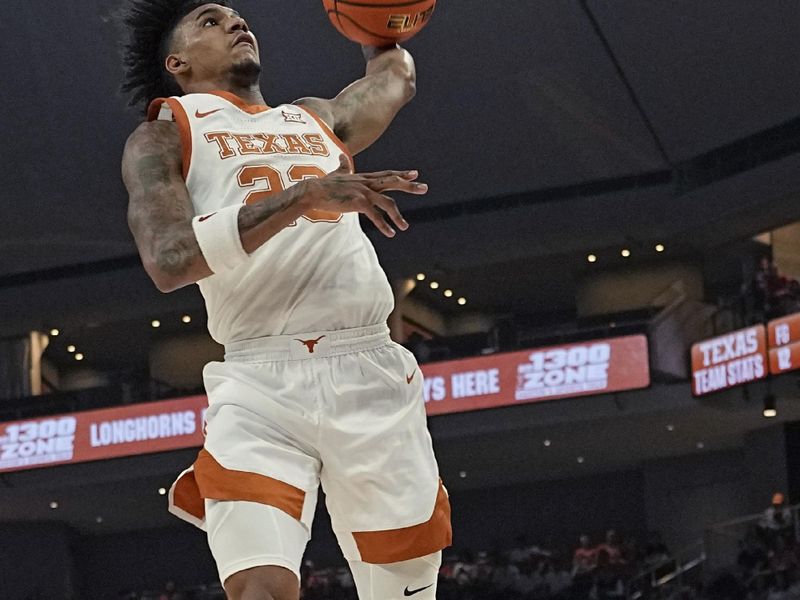 Dec 9, 2023; Austin, Texas, USA; Texas Longhorns forward Dillon Mitchell (23) dunks against the Houston Christian Huskies during the first half at Moody Center. Mandatory Credit: Scott Wachter-USA TODAY Sports