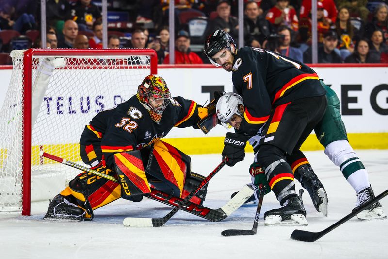 Dec 4, 2025; Calgary, Alberta, CAN; Calgary Flames goaltender Dustin Wolf (32) guards his net against the Minnesota Wild during the third period at Scotiabank Saddledome. Mandatory Credit: Sergei Belski-Imagn Images