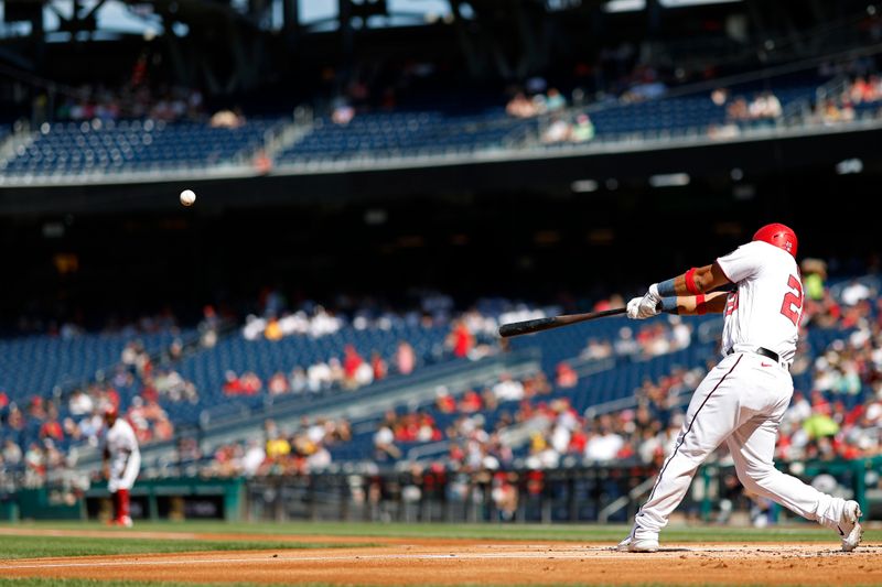 Aug 17, 2023; Washington, District of Columbia, USA; Washington Nationals designated hitter Keibert Ruiz (20) hits a double against the Boston Red Sox during the first inning at Nationals Park. Mandatory Credit: Geoff Burke-USA TODAY Sports