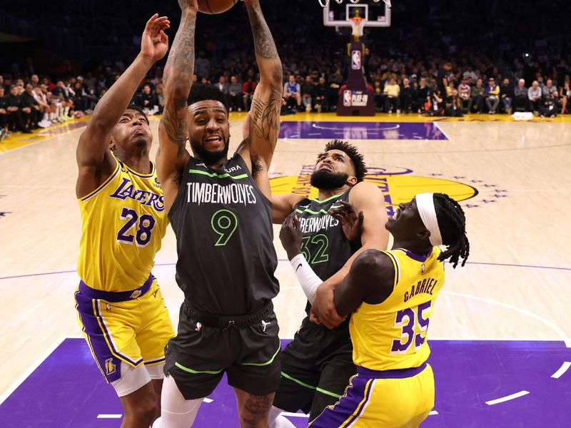 LOS ANGELES, CALIFORNIA - APRIL 11: Nickeil Alexander-Walker #9 of the Minnesota Timberwolves grabs a rebound in front of Rui Hachimura #28 and Wenyen Gabriel #35 of the Los Angeles Lakers and Karl-Anthony Towns #32 during a 108-102 Los Angeles Lakers win in a play-in tournament game at Crypto.com Arena on April 11, 2023 in Los Angeles, California. NOTE TO USER: User expressly acknowledges and agrees that, by downloading and or using this photograph, User is consenting to the terms and conditions of the Getty Images License Agreement. (Photo by Harry How/Getty Images)