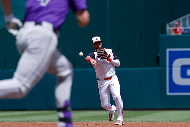 Aug 22, 2024; Washington, District of Columbia, USA; Washington Nationals second baseman Luis García Jr. (2) makes a throw to first base on a ground ball by Colorado Rockies first baseman Michael Toglia (4) during the second inning at Nationals Park. Mandatory Credit: Geoff Burke-USA TODAY Sports