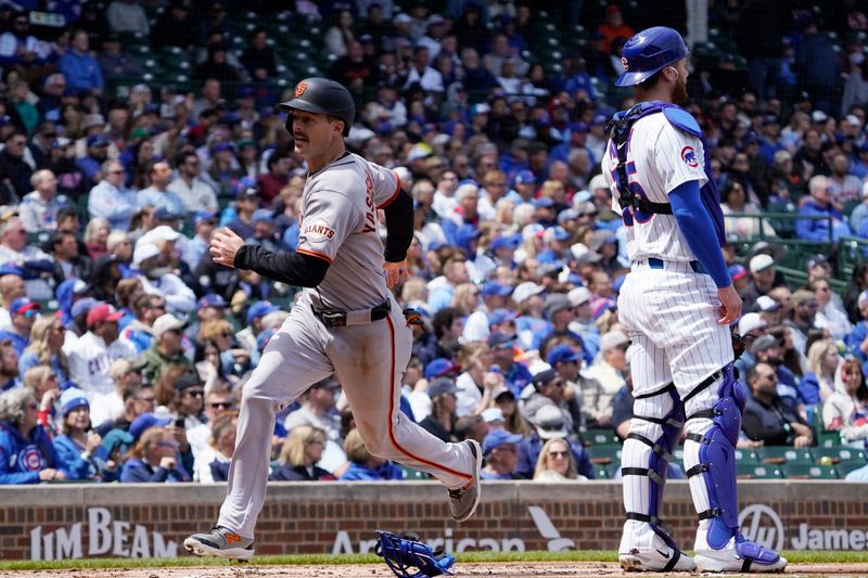 May 7, 2025; Chicago, Illinois, USA; San Francisco Giants outfielder Mike Yastrzemski (5) scores against the Chicago Cubs during the first inning at Wrigley Field. Mandatory Credit: David Banks-Imagn Images