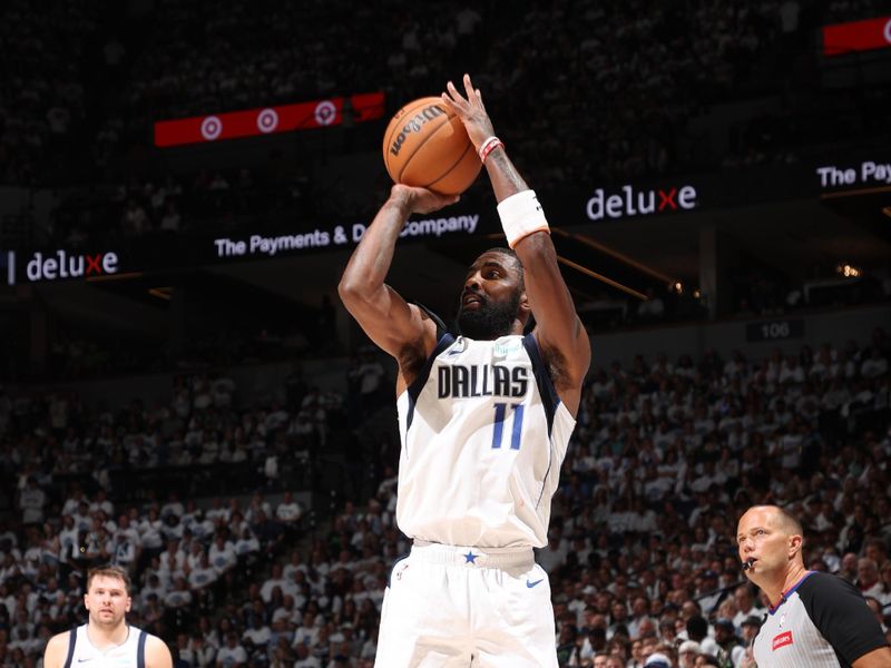 MINNEAPOLIS, MN - MAY 30: Kyrie Irving #11 of the Dallas Mavericks shoots the ball during the game against the Minnesota Timberwolves during Round 3 Game 5 of the 2024 NBA Playoffs on May 30, 2024 at Target Center in Minneapolis, Minnesota. NOTE TO USER: User expressly acknowledges and agrees that, by downloading and or using this Photograph, user is consenting to the terms and conditions of the Getty Images License Agreement. Mandatory Copyright Notice: Copyright 2024 NBAE (Photo by Joe Murphy/NBAE via Getty Images)