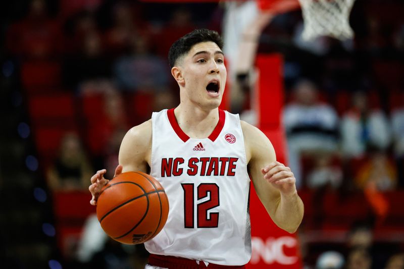 Dec 20, 2023; Raleigh, North Carolina, USA; North Carolina State Wolfpack guard Michael O'Connell (12) reacts during the first half against Saint Louis at PNC Arena. Mandatory Credit: Jaylynn Nash-USA TODAY Sports