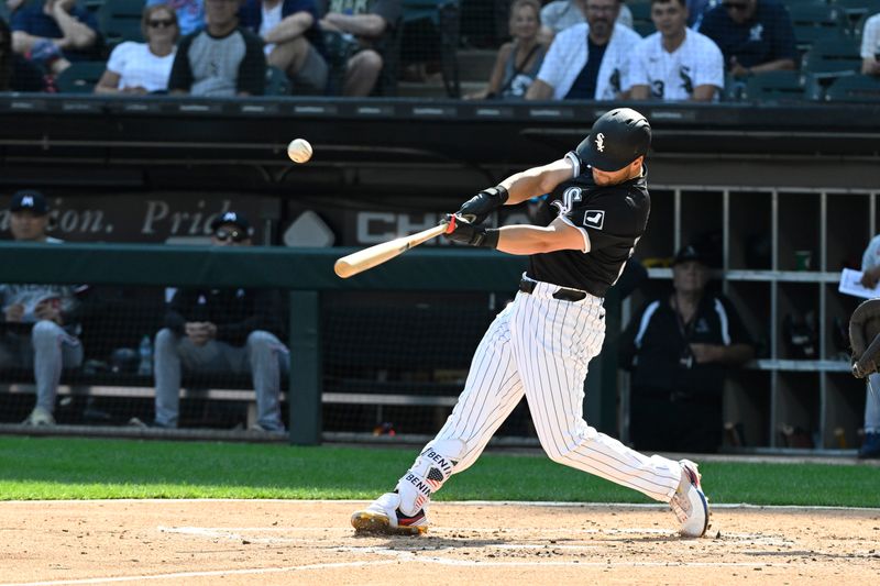 Jul 10, 2024; Chicago, Illinois, USA;  Chicago White Sox outfielder Andrew Benintendi (23) hits an RBI double against the Minnesota Twins during the second inning at Guaranteed Rate Field. Mandatory Credit: Matt Marton-USA TODAY Sports