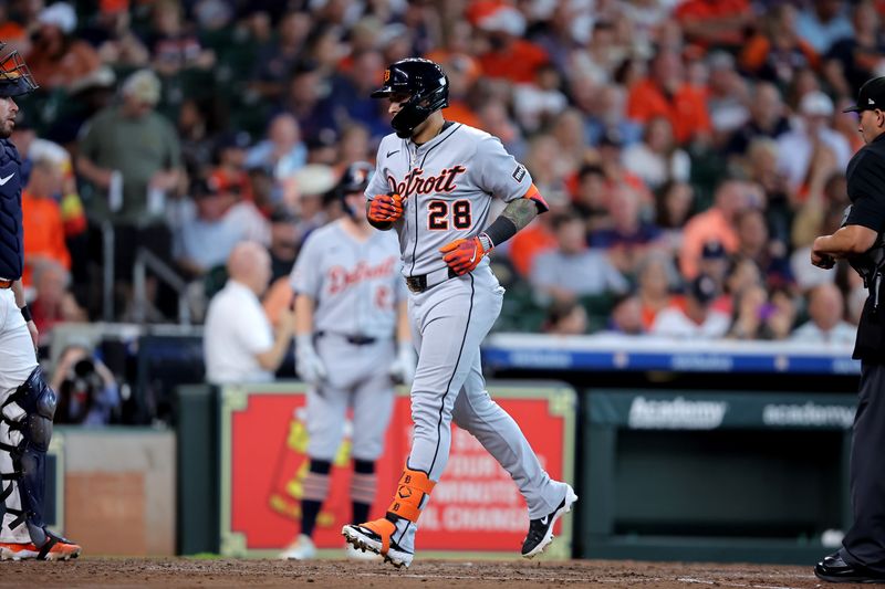 Apr 30, 2025; Houston, Texas, USA; Detroit Tigers center fielder Javier Baez (28) crosses home plate after hitting a grand slam home run against the Houston Astros during the third inning at Daikin Park. Mandatory Credit: Erik Williams-Imagn Images