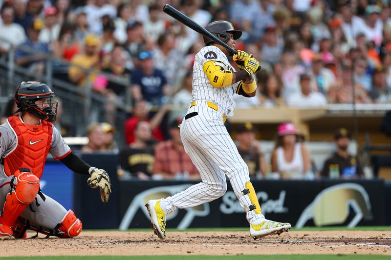 Sep 7, 2024; San Diego, California, USA; San Diego Padres designated hitter Luis Arraez (4) singles during the third inning against the San Francisco Giants at Petco Park. Mandatory Credit: Chadd Cady-Imagn Images