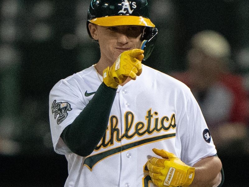 Sep 18, 2023; Oakland, California, USA;  Oakland Athletics second baseman Zack Gelof (20) points to the dugout after hitting a single during the third inning against the Seattle Mariners at Oakland-Alameda County Coliseum. Mandatory Credit: Stan Szeto-USA TODAY Sports