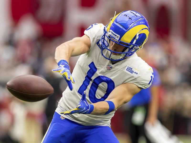 Wide receiver (10) Cooper Kupp of the Los Angeles Rams warms up before playing against the Arizona Cardinals in an NFL football game, Sunday, Sept. 25, 2022, in Glendale, AZ. Rams won 20-12. (AP Photo/Jeff Lewis)