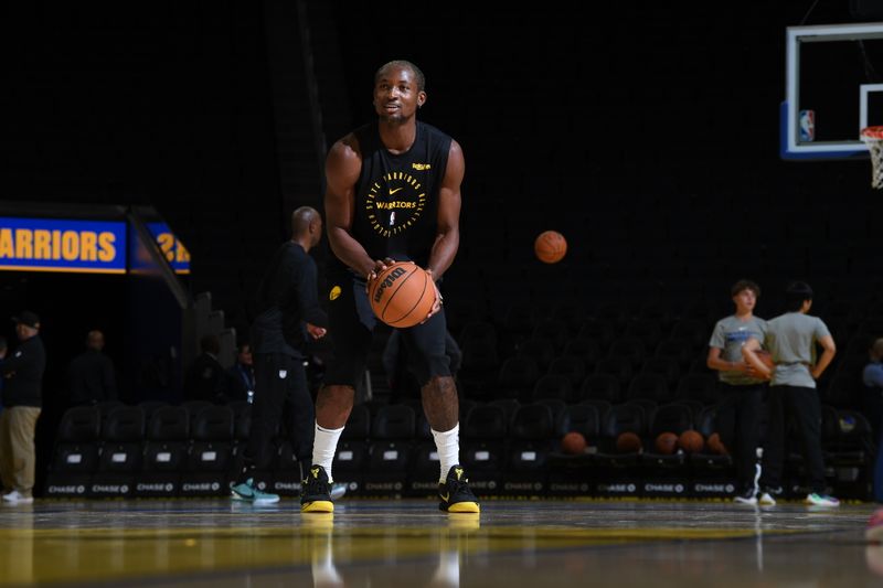 SAN FRANCISCO, CA - OCTOBER 11: Jonathan Kuminga #00 of the Golden State Warriors warms up before the game against the Sacramento Kings during a NBA Preseason game on October 11, 2024 at Chase Center in San Francisco, California. NOTE TO USER: User expressly acknowledges and agrees that, by downloading and or using this photograph, user is consenting to the terms and conditions of Getty Images License Agreement. Mandatory Copyright Notice: Copyright 2024 NBAE (Photo by Noah Graham/NBAE via Getty Images)