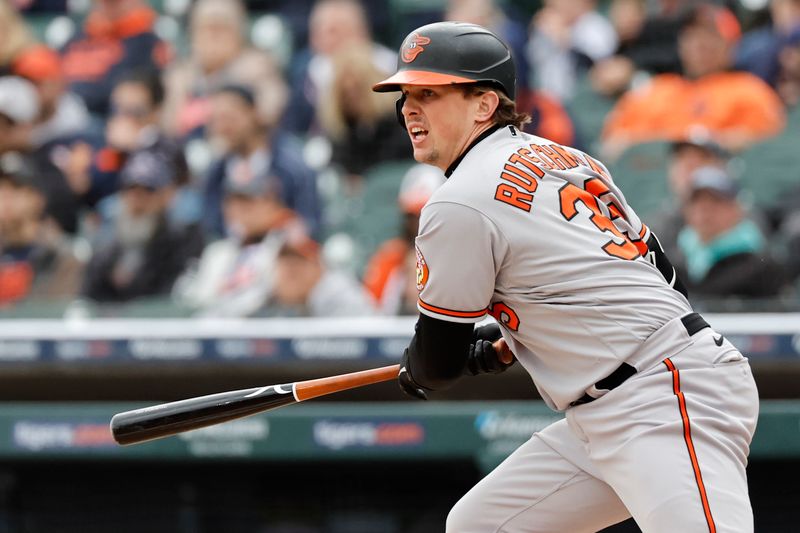 Apr 30, 2023; Detroit, Michigan, USA;  Baltimore Orioles catcher Adley Rutschman (35) hits a double in the third inning against the Detroit Tigers at Comerica Park. Mandatory Credit: Rick Osentoski-USA TODAY Sports